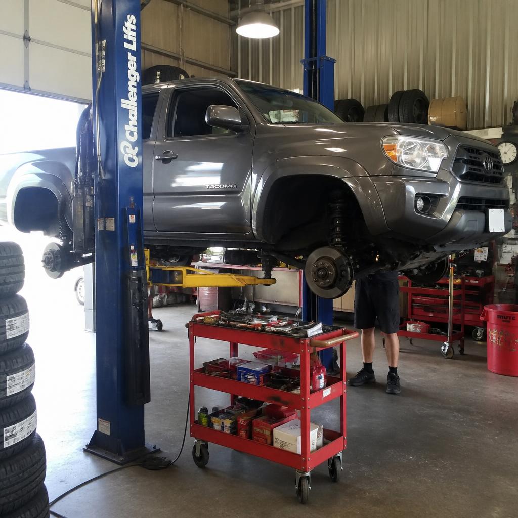 Pickup truck raised on a lift for repair work